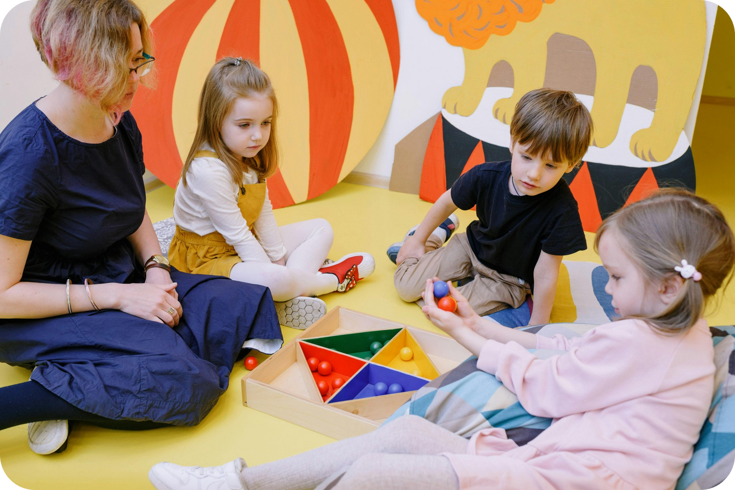Children playing on a linen playmat